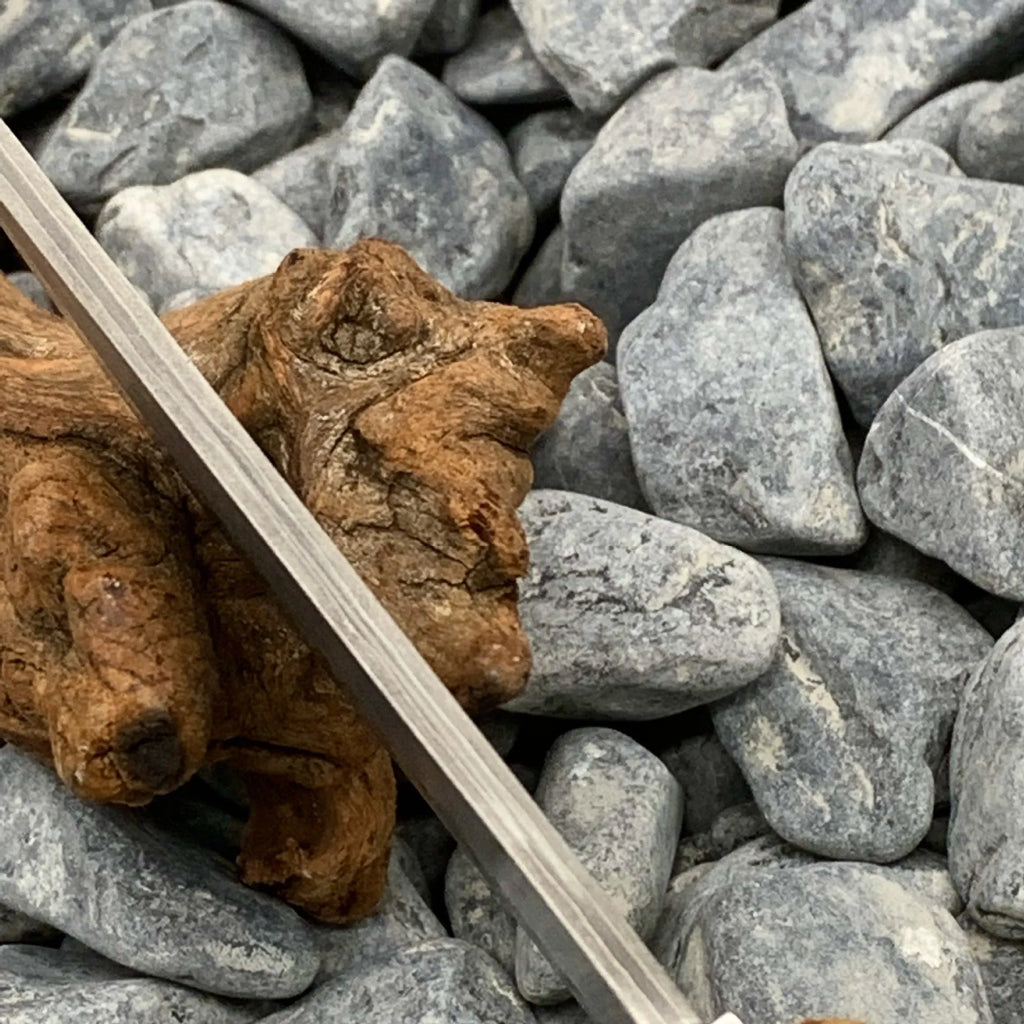 White Shadow Damascus pattern camping knife with Thuja wood handle, showing full 18cm length.