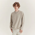 Men's loose fit long-sleeved cotton blend t-shirt in black, shown on a model.