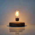 Magnetic levitation bulb night light in solid wood colour floating above plastic base