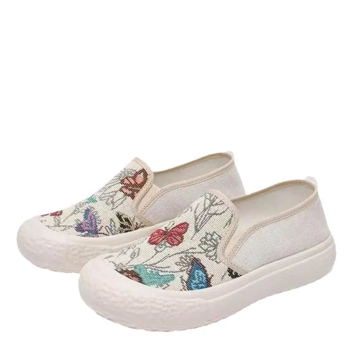 Women's Old Beijing-style slip-on canvas shoes in black or white with a round toe and plastic sole.