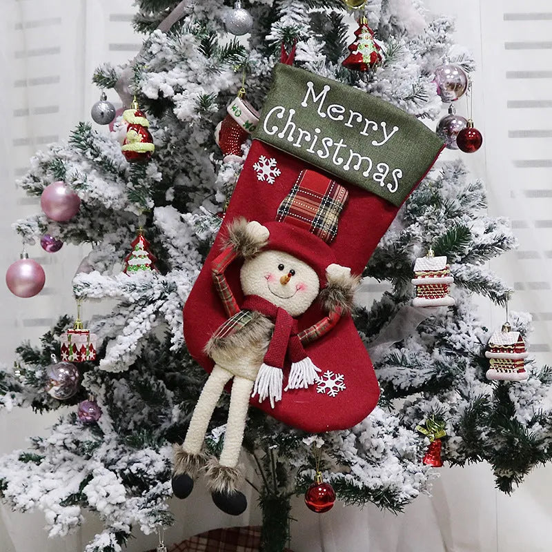 Three large red Christmas stockings with Santa, Snowman and Reindeer 3D applique designs