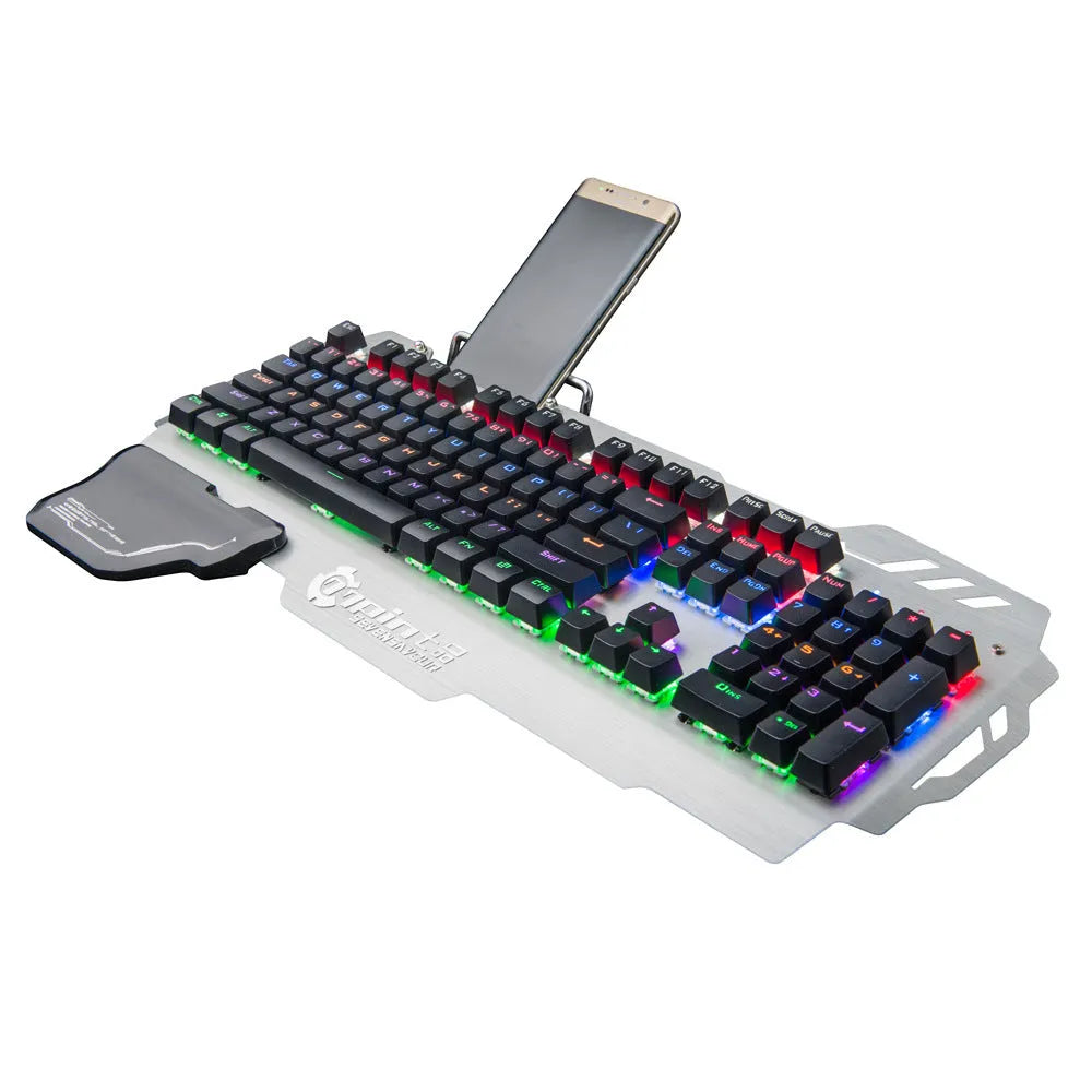 Silver metal panel professional gaming keyboard with built-in wrist splint on a desktop.