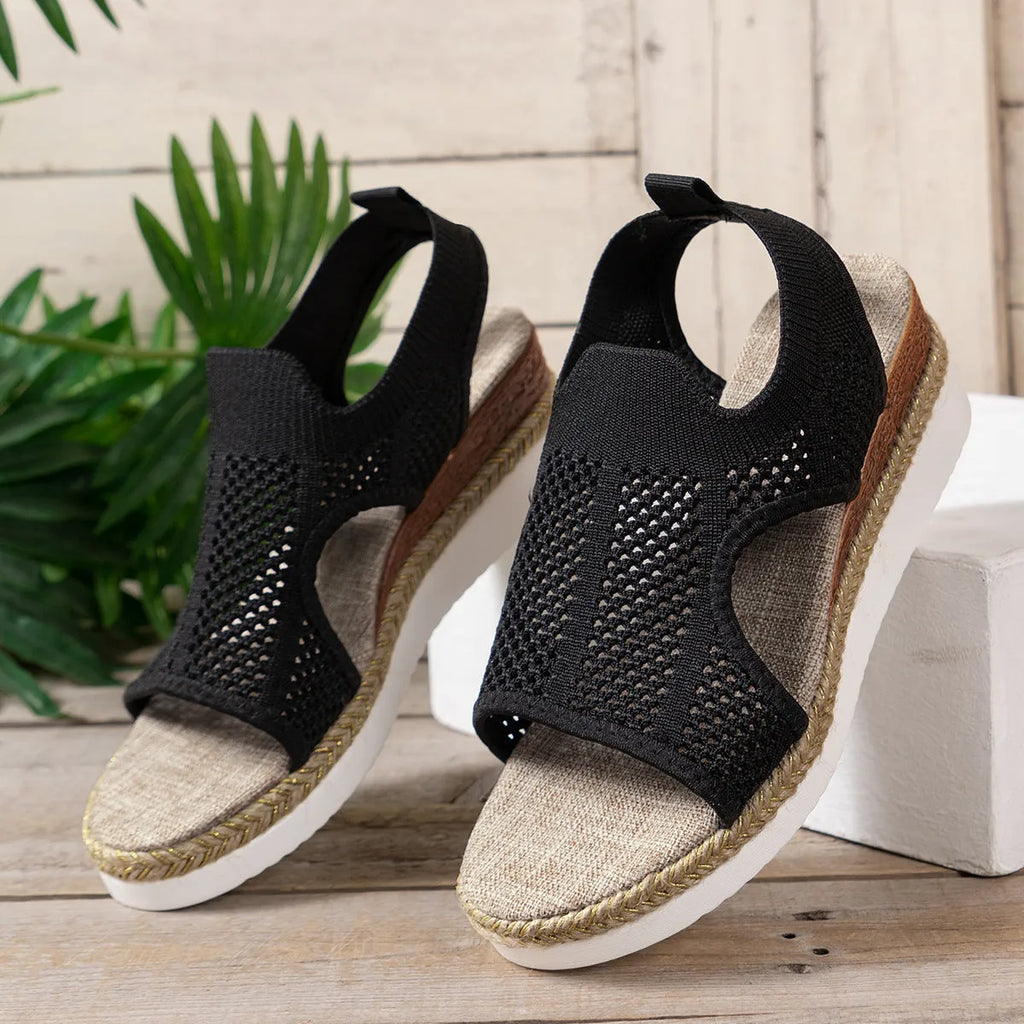 Women's hollow wedge peep-toe sandals in beige with patent leather upper and breathable mesh, side view