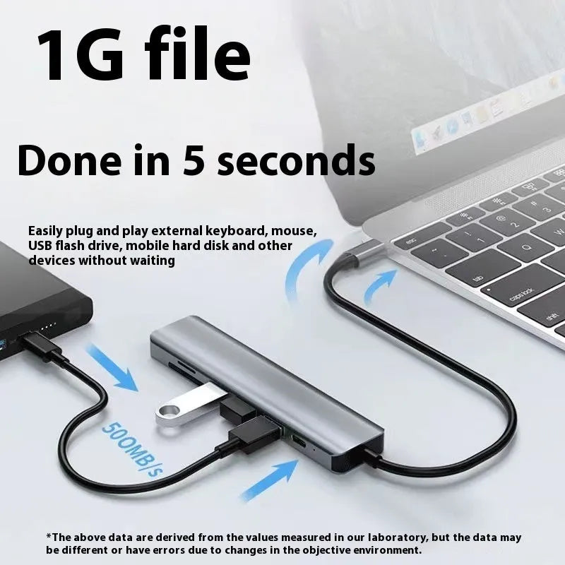 Silver aluminium USB-C 7-in-1 expansion dock with HDMI, VGA, USB 3.0 ports, and a 15cm cable