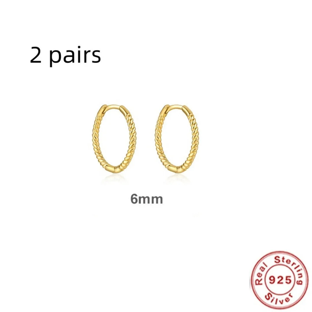 Sterling silver twisted round ring earrings in gold or white gold finish, shown in 6mm, 7mm, 8mm, and 13mm sizes.