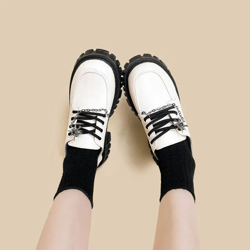 Women's Duke Asterism coloured loafers with a metal cross-strap and round toe in a preppy style.
