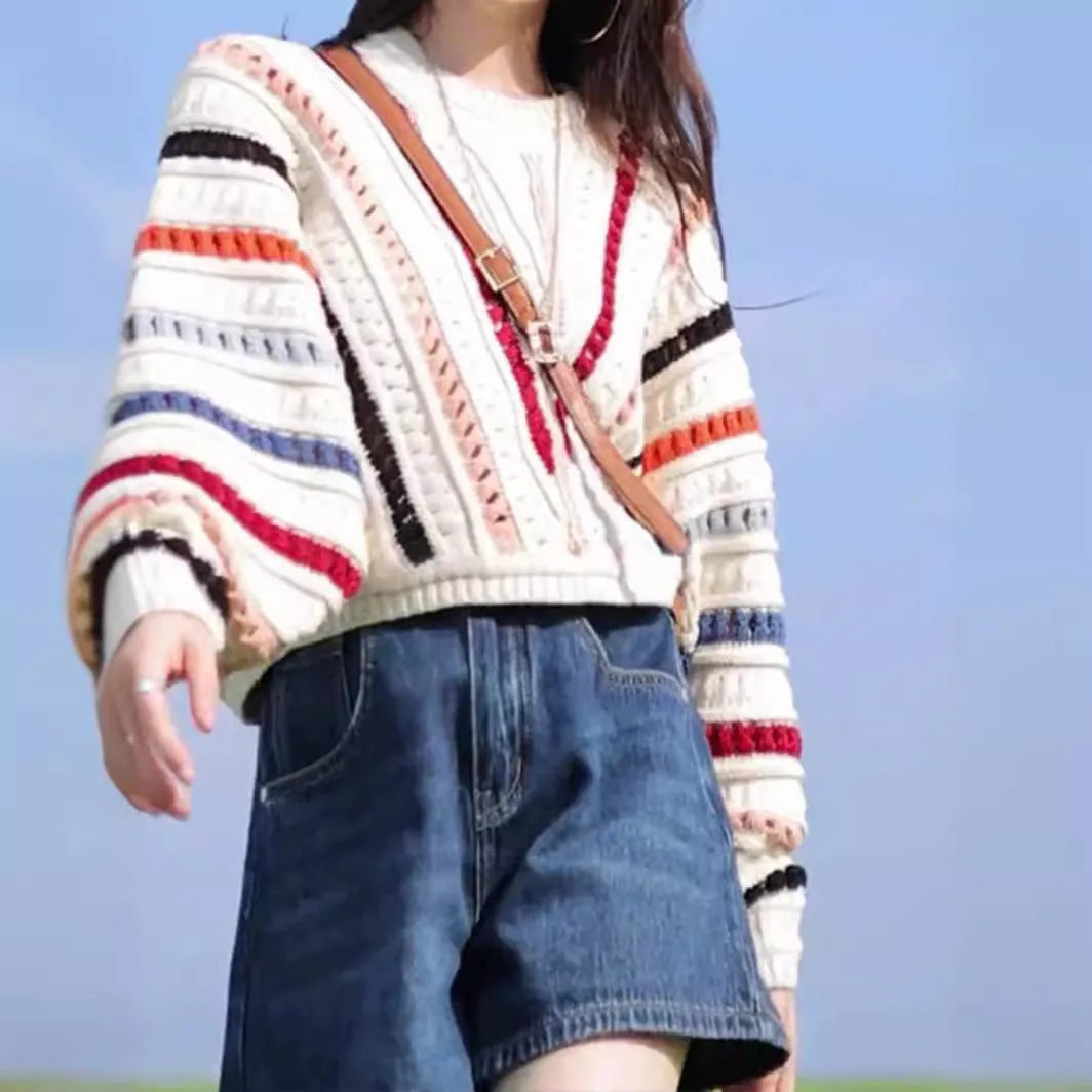 Rainbow striped hollow knit sweater with batwing sleeves in retro chic design