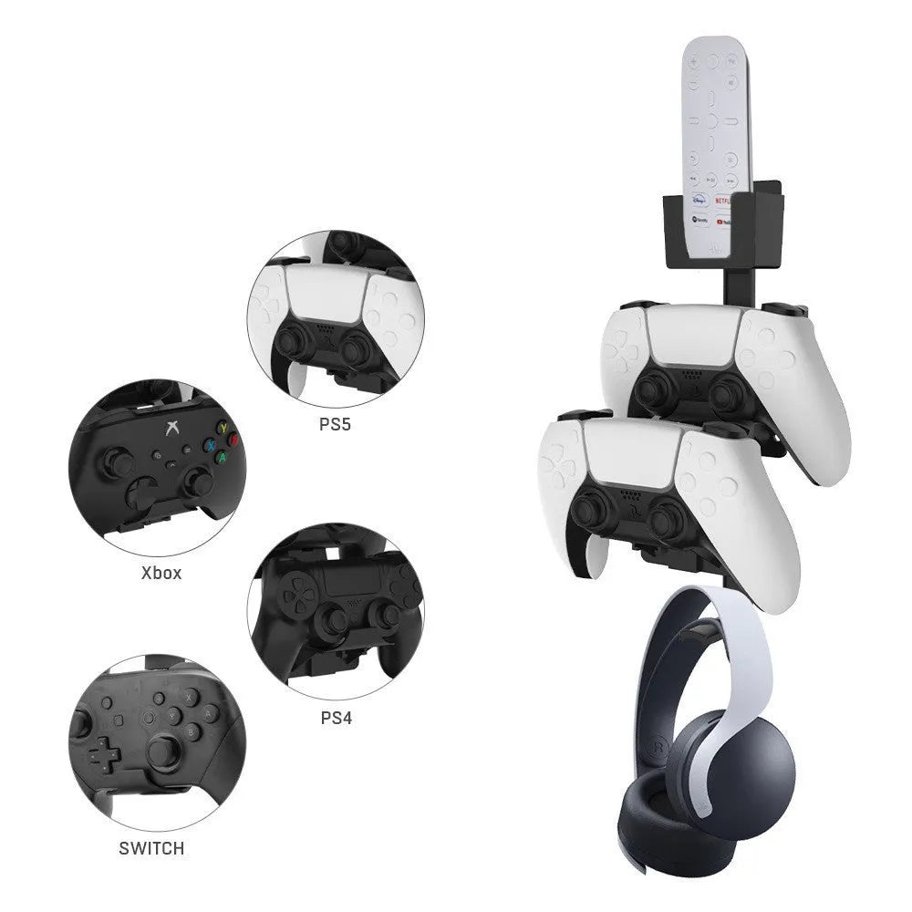White adhesive wall hook holding a black game controller and a TV remote.