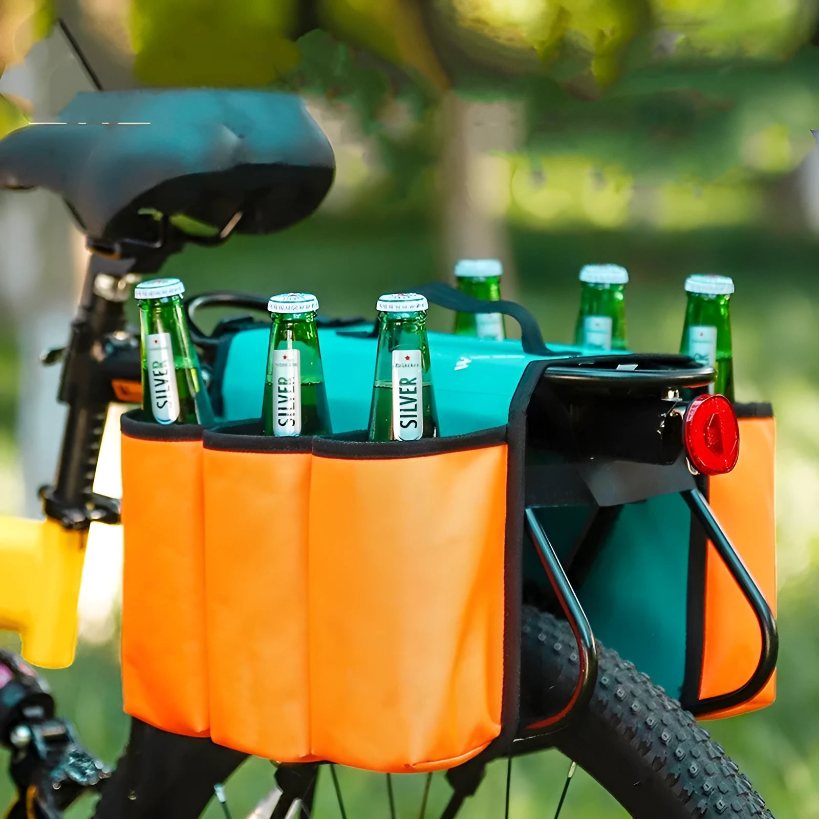 Black and orange double-sided bicycle drink storage bag mounted on a bike frame.