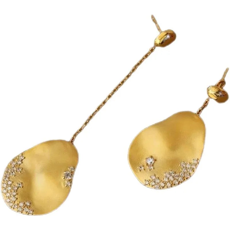 Asymmetric floral earrings with zircon stone detailing in gold-plated silver or gold finish