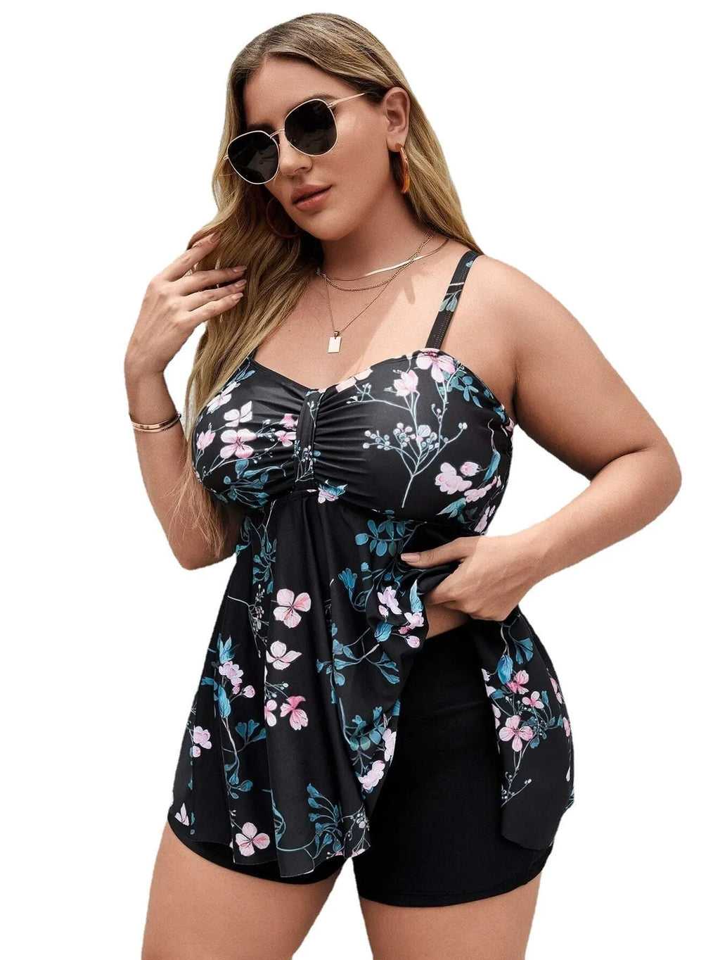 Women's floral print one-piece swimsuit on hanger, showing split colour design and high-elasticity polyester fabric.