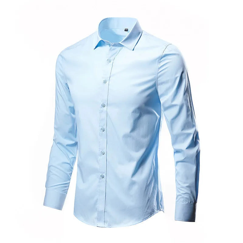 Man wearing a loose-fit long-sleeve linen shirt in a neutral colour.