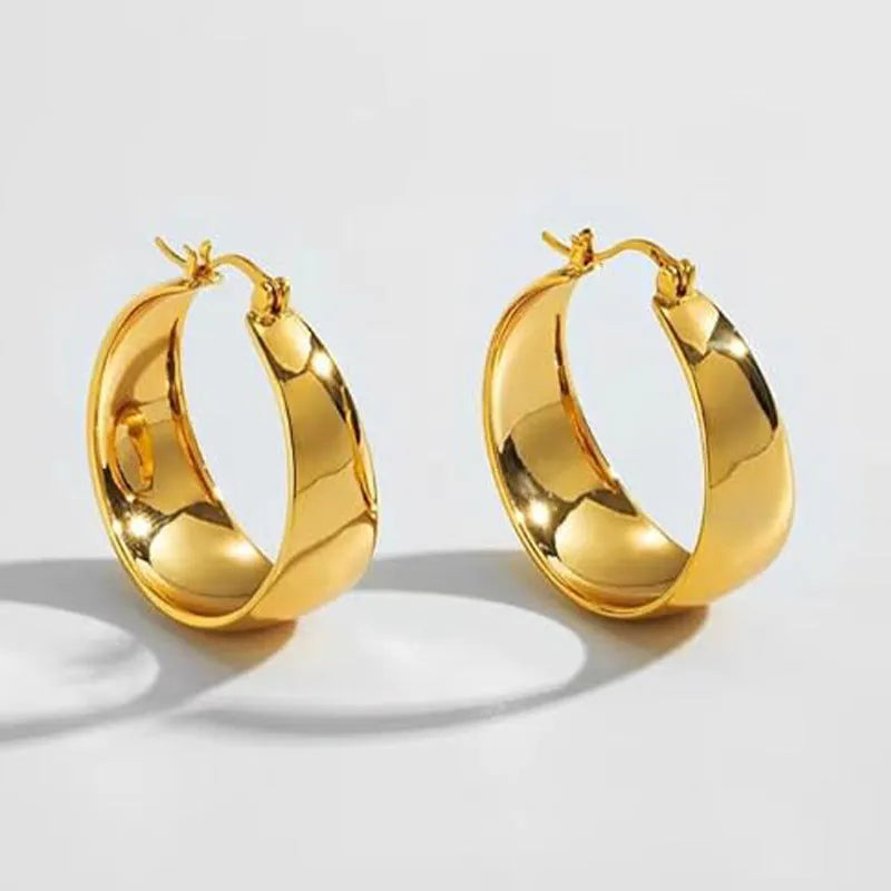 Stainless steel widened curved earrings in gold or steel colour, 25mm or 30mm sizes