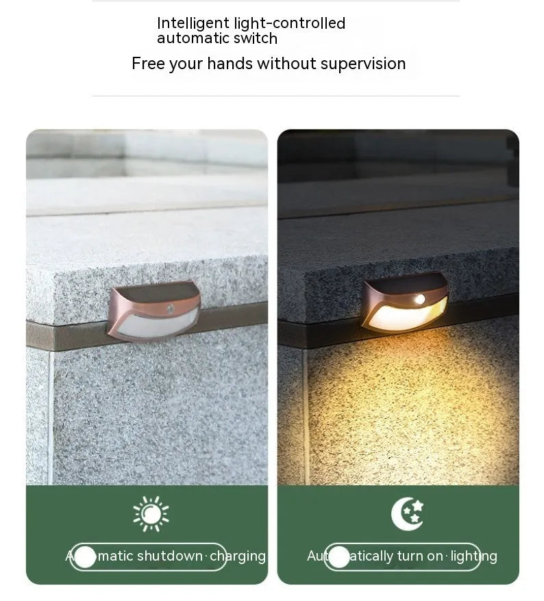 Solar outdoor wall lamp with decorative smiling face design for garden and courtyard lighting