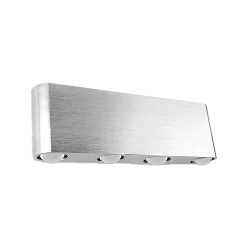 Silver aluminium rectangular LED wall lamp mounted on a wall, displaying multiple light colour options.
