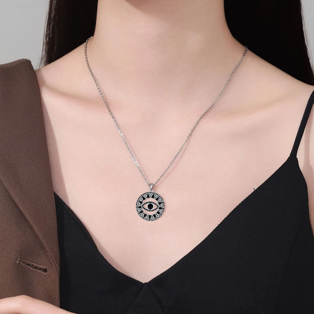 Copper electroplated Devil's Eye pendant necklace with a cross chain for women.