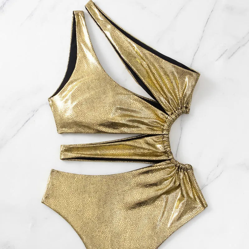Women's gold backless one-piece swimsuit with Spandex lining shown in sizes S, M, L