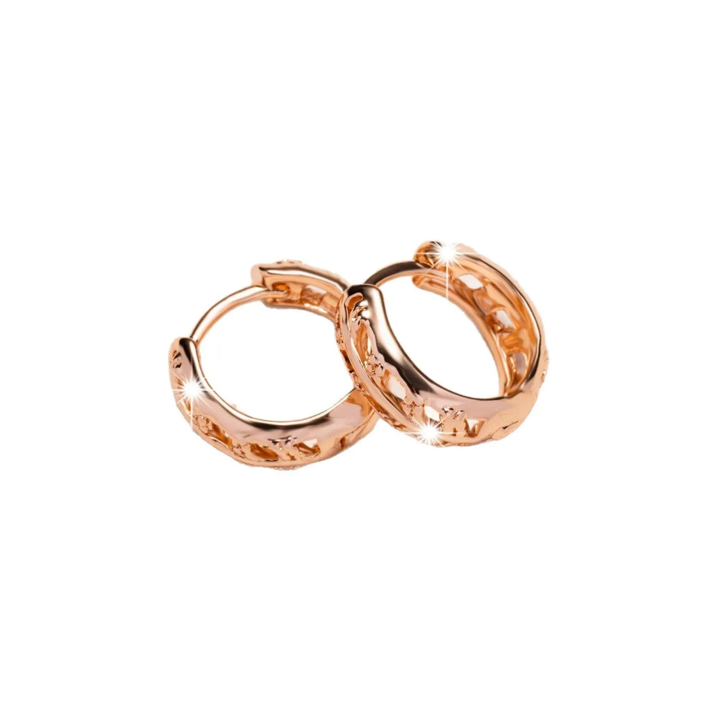 Small copper earrings with hollowed-out leaf and heart shapes, rose gold plated.