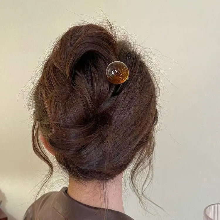 Acrylic U-shaped hair barrettes with ball decoration in beige, caramel, dark grey, and green colours