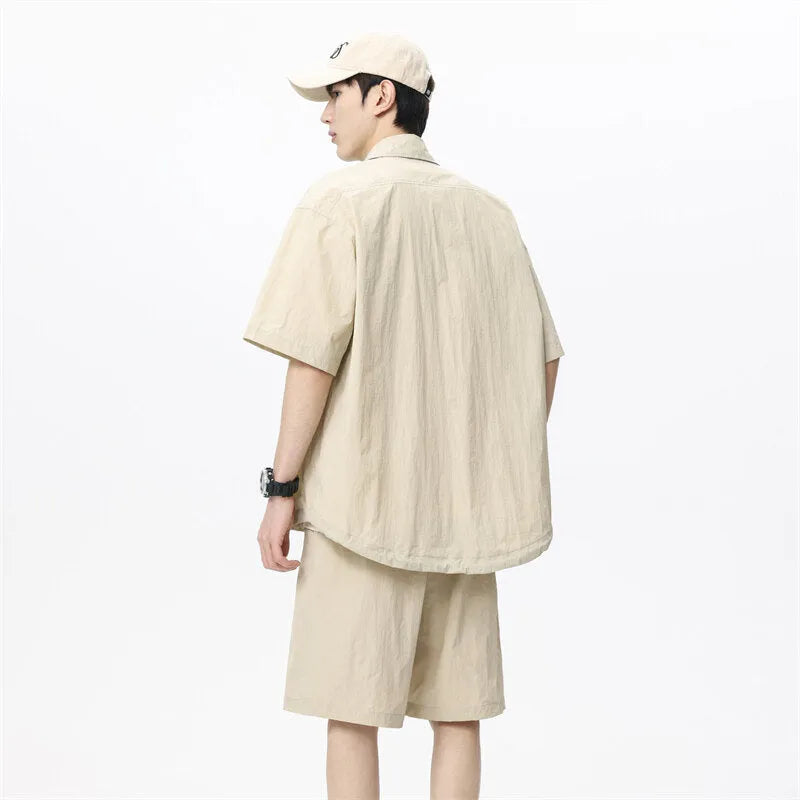 Men's dark grey loose shorts and casual shirt two-piece set made from hemp-blend fabric.