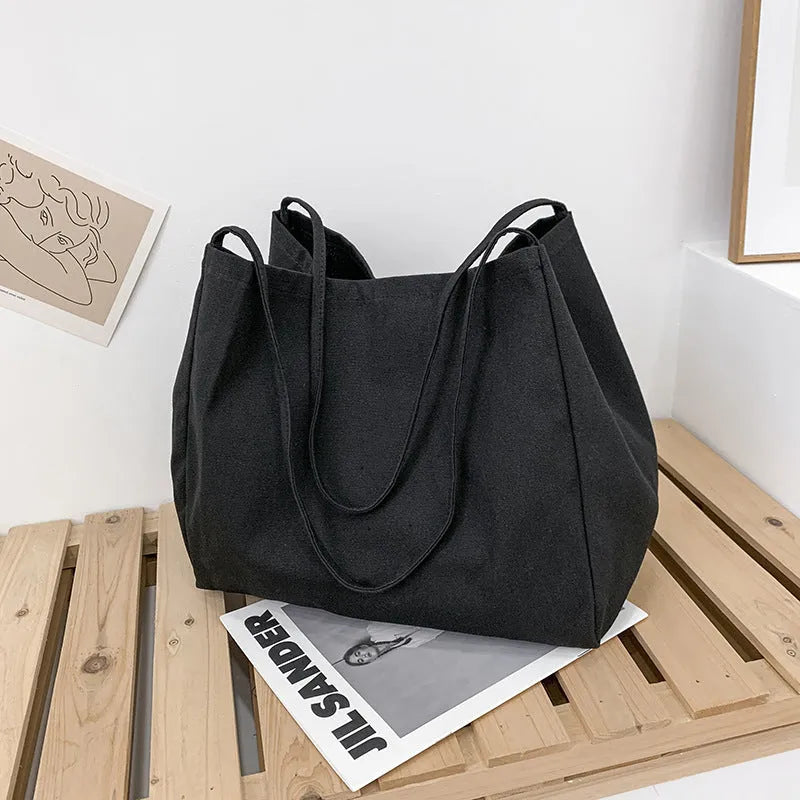 Women's solid colour canvas handbag with double shoulder straps and mobile phone pocket
