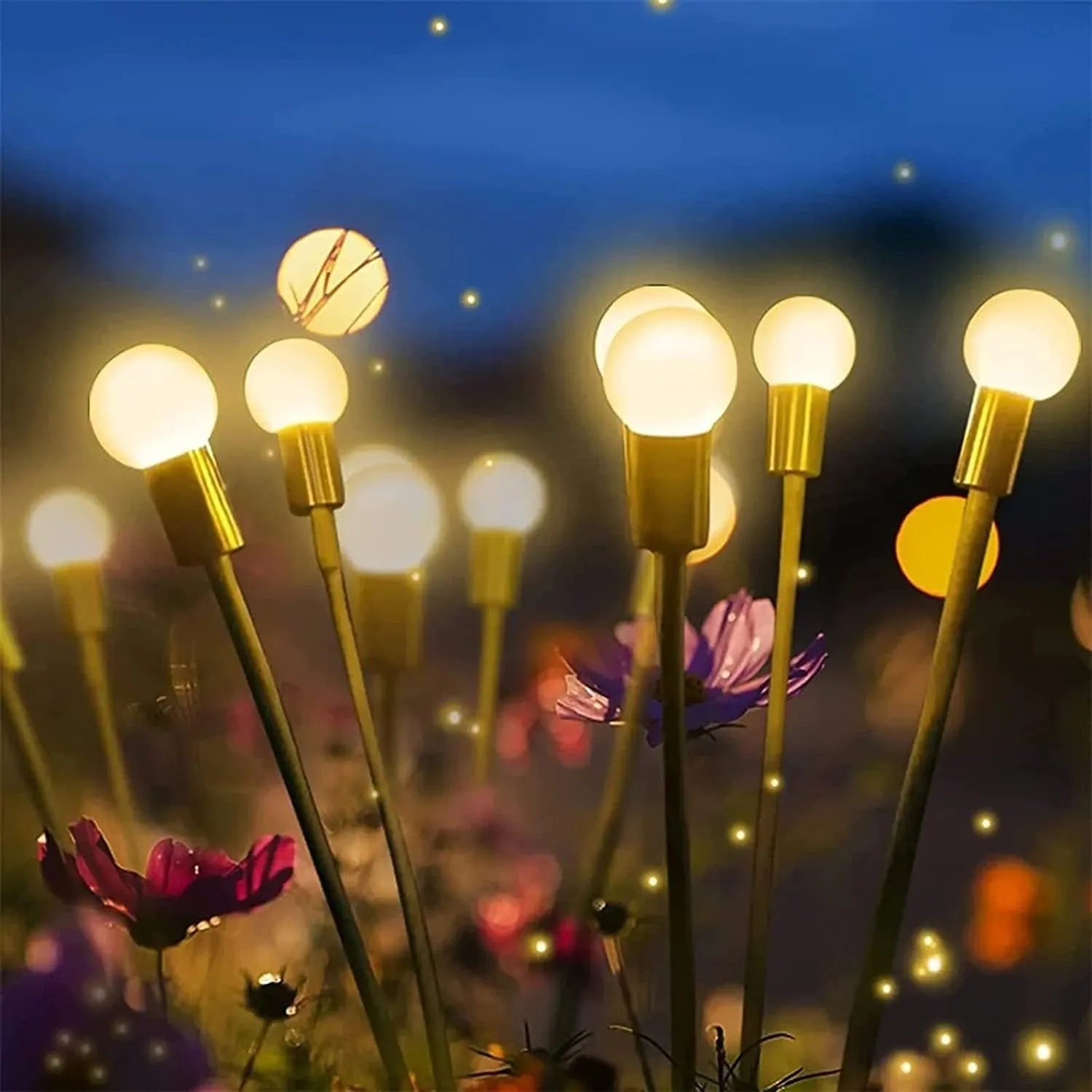 Solar-powered LED pneumatic firefly ground stake light with multiple heads on a grassy lawn.