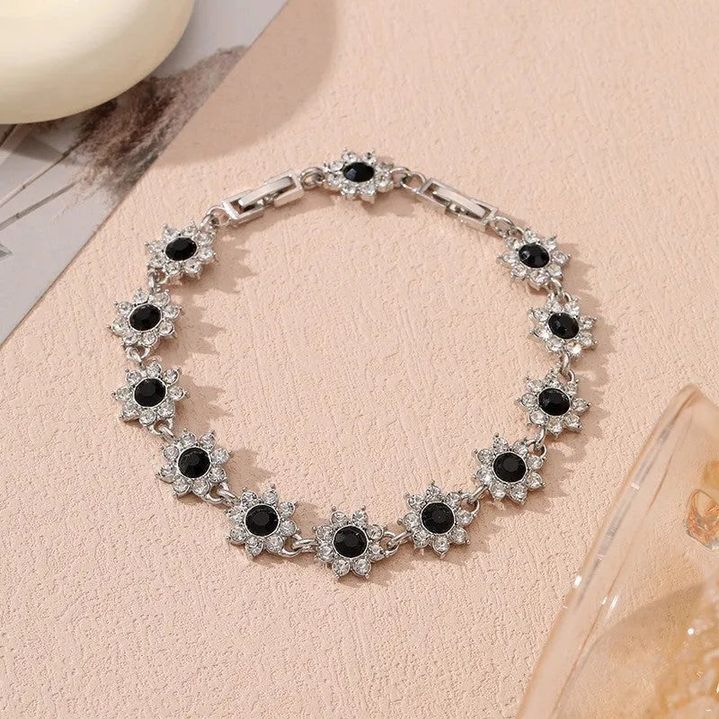Women's zinc alloy bracelet with flower design and electroplated finish in gold and silver colour options