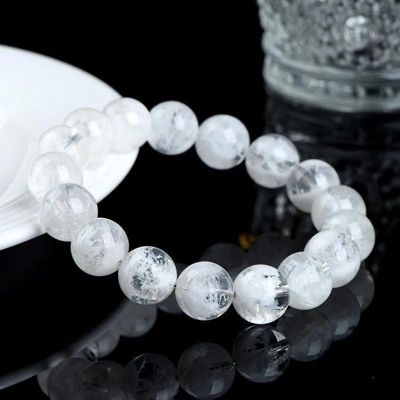 Crystal bracelet with natural blizzard pattern showing Ruyi and Xiangyun elements on round beads
