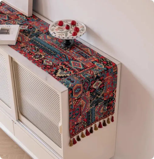 Retro style polyester table flag with long handwoven tassels on a wooden table.