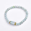 Myanmar Jade round bead bracelet in emerald green with geometric ethnic style design