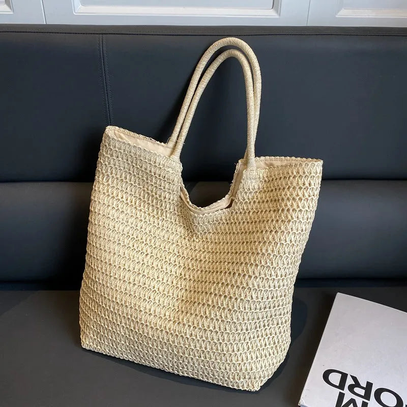 Women's large capacity straw bag in beige with canvas lining and double shoulder straps
