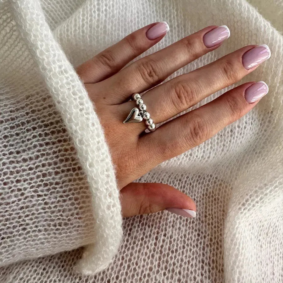Handmade beaded elastic string love ring with geometric heart design in gold electroplated finish
