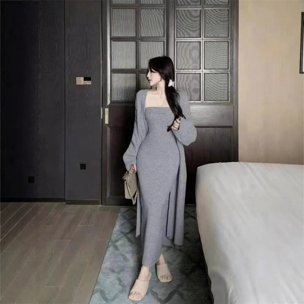 Women's grey knitted cardigan and dress two-piece suit set on a hanger.