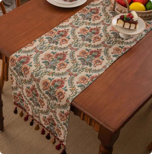 Retro style polyester table flag with long handwoven tassels on a wooden table.