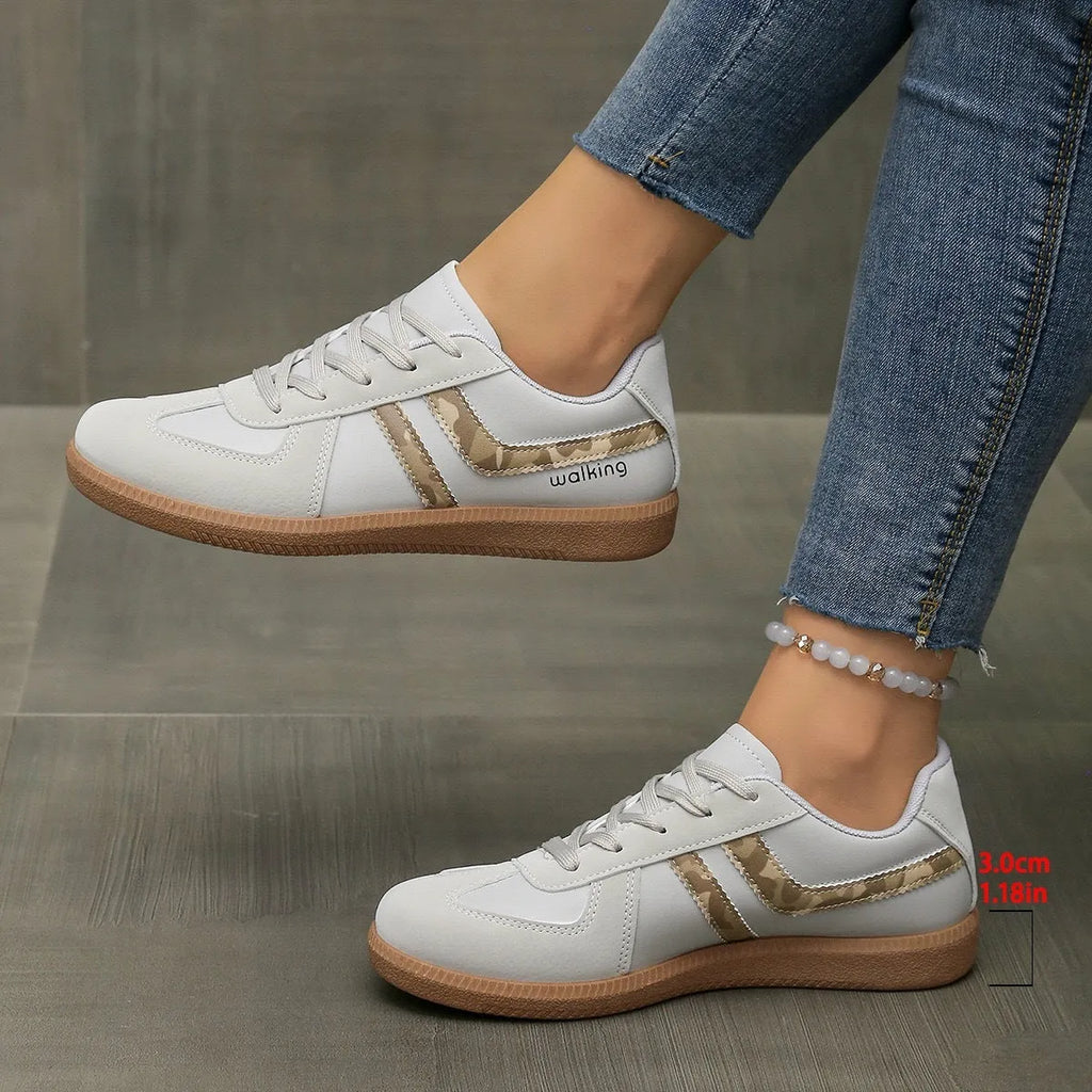 Women's retro casual training sneakers in a low-top style with a lace-up front and round toe.