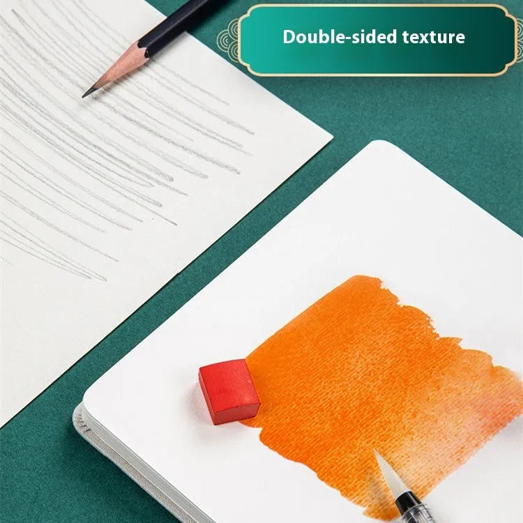Fabric-bound handmade watercolour notebook with artistic cover design for character sketching