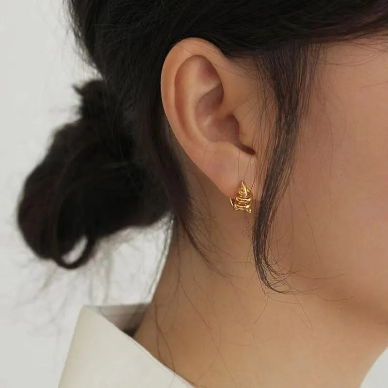 Spiral wound ear clip earrings in frosted geometric shape, copper with gold or silver plating, 1.75cm by 2.16cm.