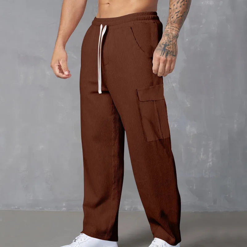 Men's corduroy cargo trousers in loose-fitting wide-leg style with drawstring waist