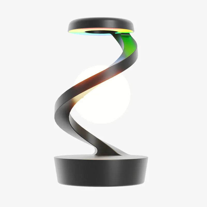 Rotating moon desk lamp with wireless charger in grey on a bedside table