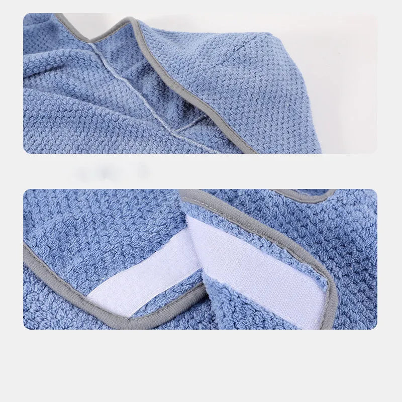 Blue adjustable dog bath robe towel wrapped around a dog, showing the waistband fastener and absorbent fabric.