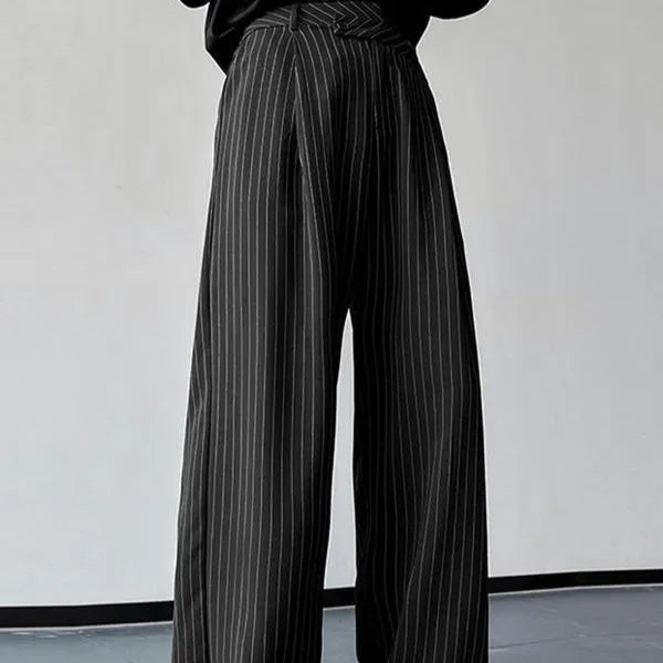 Men's black vertical striped pleated casual trousers laid flat.