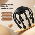 Black handheld head massager with multiple vibrating nodes for scalp stimulation