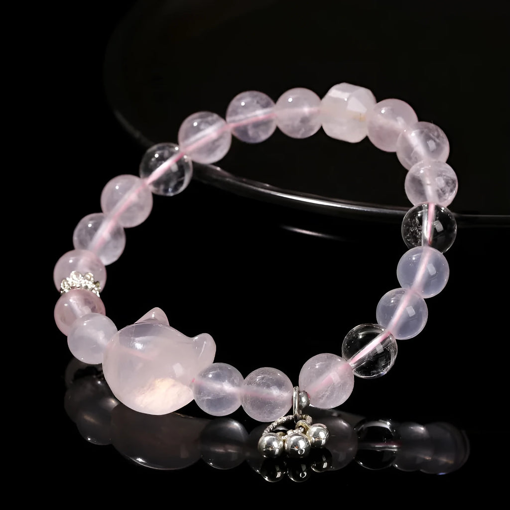 Women's natural crystal bracelet collection showing nine different designs including cat head, bear, and snowflake motifs