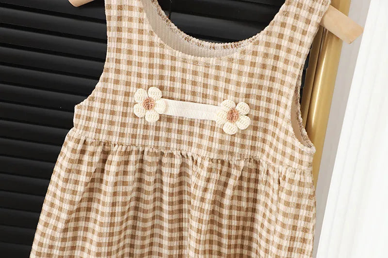 Baby girl wearing a dark coffee plaid long-sleeved dress and matching shirt, Korean style two-piece set.