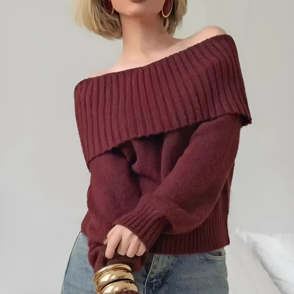Grey off-the-shoulder strapless sweater with a 3D textured pattern, shown on a model.