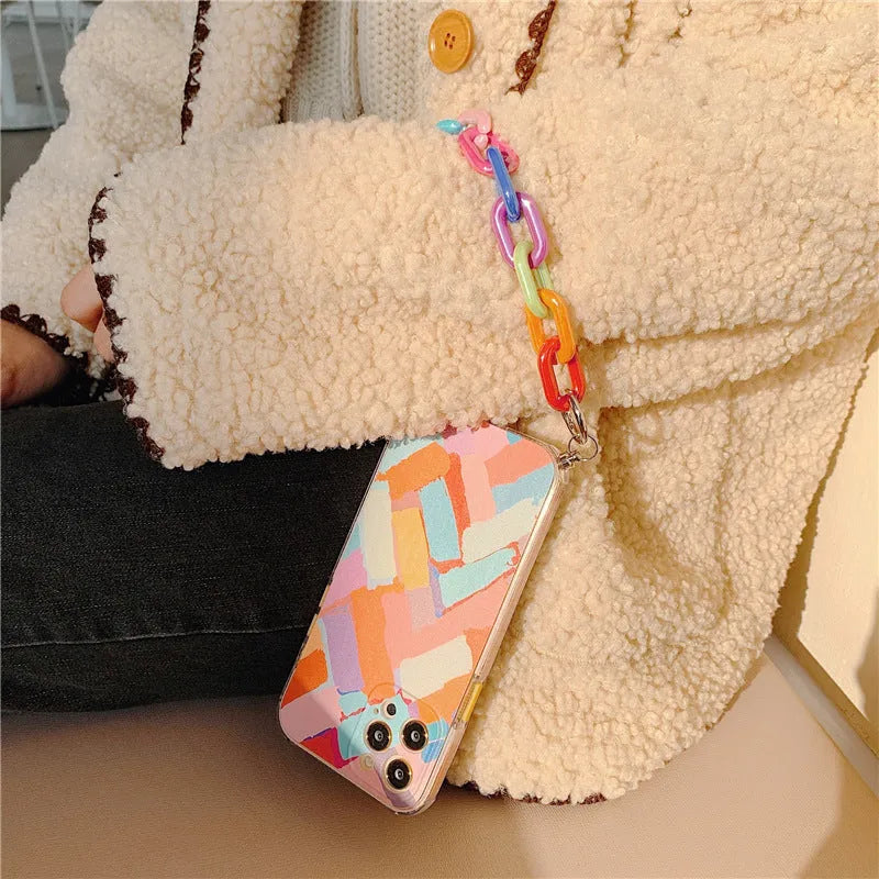 Graffiti print iPhone protective case with integrated wrist bracelet connector in pink design