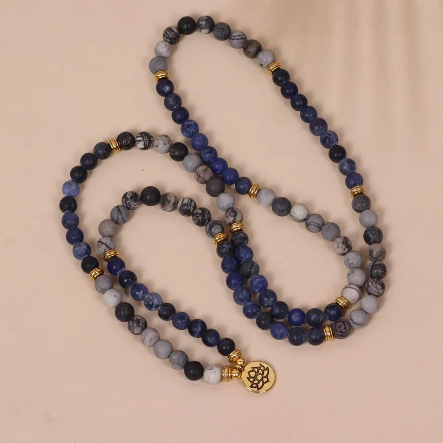Blue multi layer bracelet with patterned network stone beads on alloy strands