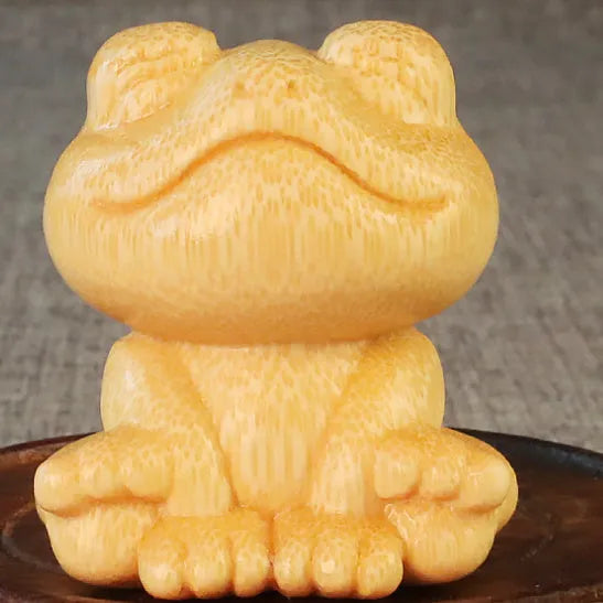 Solid bamboo smiling frog carving ornament with cartoon style measuring 5cm tall