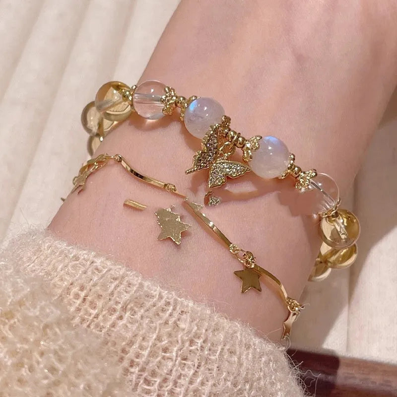 Women's Moonstone White crystal bracelet with diamond-shaped beads and a butterfly charm in Chinese style.