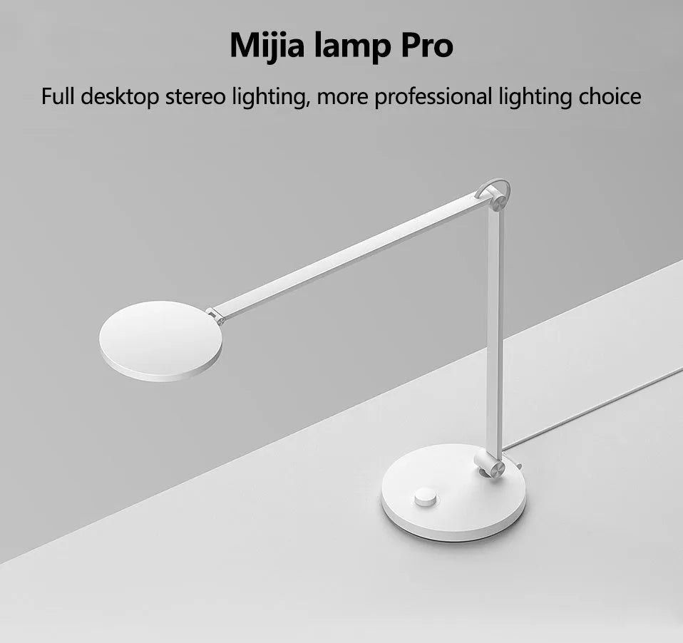 ProLED intelligent folding desk lamp with adjustable arm on a wooden desk.